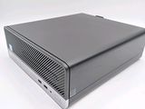 the computer is sitting on a white surface with a white background