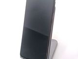 a cell phone that is sitting on top of a stand