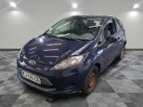 a picture of a blue ford fiesta parked in a garage