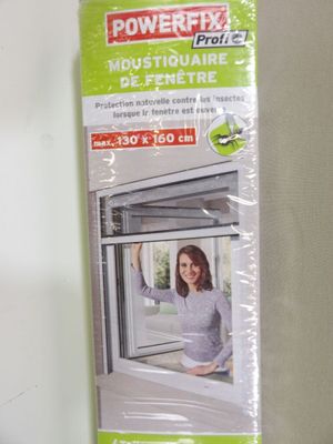 packaging for a window with a picture of a woman looking out of it
