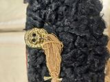 a small black book with a gold skull on it