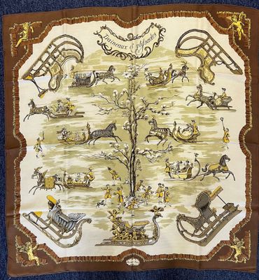 a scarf with a picture of a tree and people on it