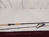 a close up of a fishing rod and a fishing rod on a bed