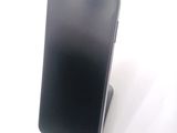 a cell phone that is sitting on top of a stand