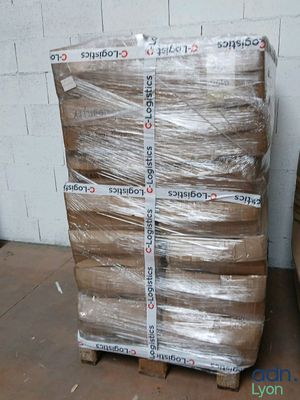 a large stack of boxes sitting on a pallet in a warehouse