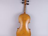 an old violin with a wooden back and a black bow