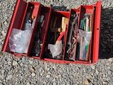 a red box that has a bunch of items in it