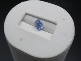 a blue sapphire in the middle of a white container
