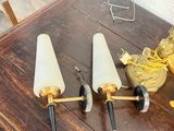 three candles that are sitting on a table next to a banana