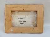 an old wooden picture frame with writing on the inside of it