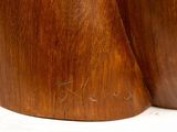 two wooden vases that are sitting on a table