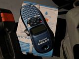 a cell phone sitting on top of a bag next to other items