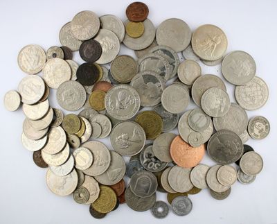 a pile of coins on a table with a white background