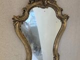 a mirror hanging on the wall in a room