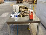 a table with a bottle of water and a bottle of alcohol on it