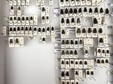 a picture of a wall with a lot of buttons on it