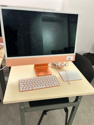 a computer on a desk with a keyboard and mouse