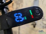a close up of a digital clock on a bike