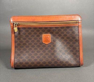 a brown and orange purse with a zipper on it