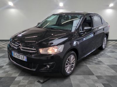 a picture of a black car parked in a garage