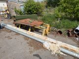 a lot of pipes and a table in the yard