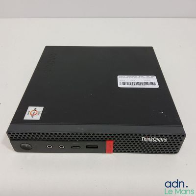 a close up of a small black computer on a white surface