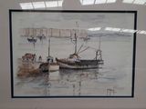 framed watercolor painting of a boat in a harbor with a red wall in the background