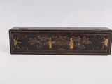 a black and gold box with birds on it on a white background