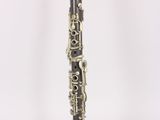 a clarinet that is sitting on a white surface