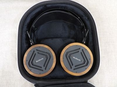 a pair of headphones in a case on a table