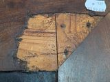 a piece of wood that has been stripped off of the floor