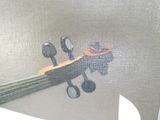 a painting of a violin on the wall of a bathroom