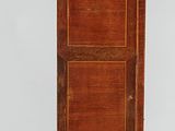 a small wooden cabinet on a dolly with wheels on the floor