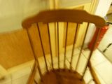 a wooden chair that is sitting in a room