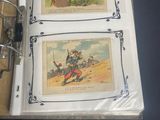 two books with pictures on them sitting on a table