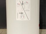 a water heater that is sitting on the floor