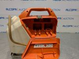 a close up of an orange tool box on a gray surface
