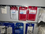 many different types of sewing needles on the wall