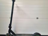 a scooter that is parked in front of a garage door