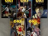 six books of anime comics on a table with a woman holding a knife