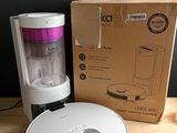 a small blender sitting on a table next to a box
