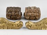 four pieces of carved wood and brass on a white background