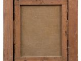 an old wooden picture frame with a label on it