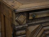 a wooden dresser with a clock on top of it