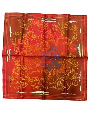 a close up of a red and orange handkerchief on a white background