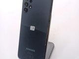 a picture of a samsung phone on a stand on a table