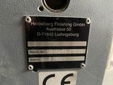 a close up of a metal sign on a machine