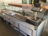 an image of a counter with a laptop on top of it