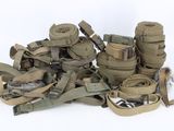 a pile of military equipment on a white surface