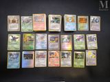 the pokemon cards are lined up on a black surface